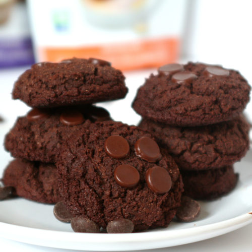 Brownie cookies stacked on a white plate