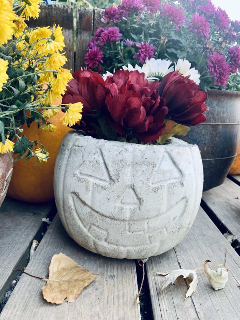 DIY Concrete pumpkin on porch with flowers.   

DIY Concrete Pumpkin these are so fun and easy to make! #diy #diyhalloween #diyfalldecor #diyconcrete pumpkin www.innovativehealthfitness.com