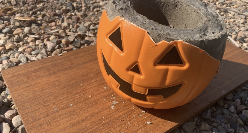 Removed the top part of the plastic pumpkin from the hardened concrete.

DIY Concrete Pumpkin these are so fun and easy to make! #diy #diyhalloween #diyfalldecor #diyconcrete pumpkin www.innovativehealthfitness.com