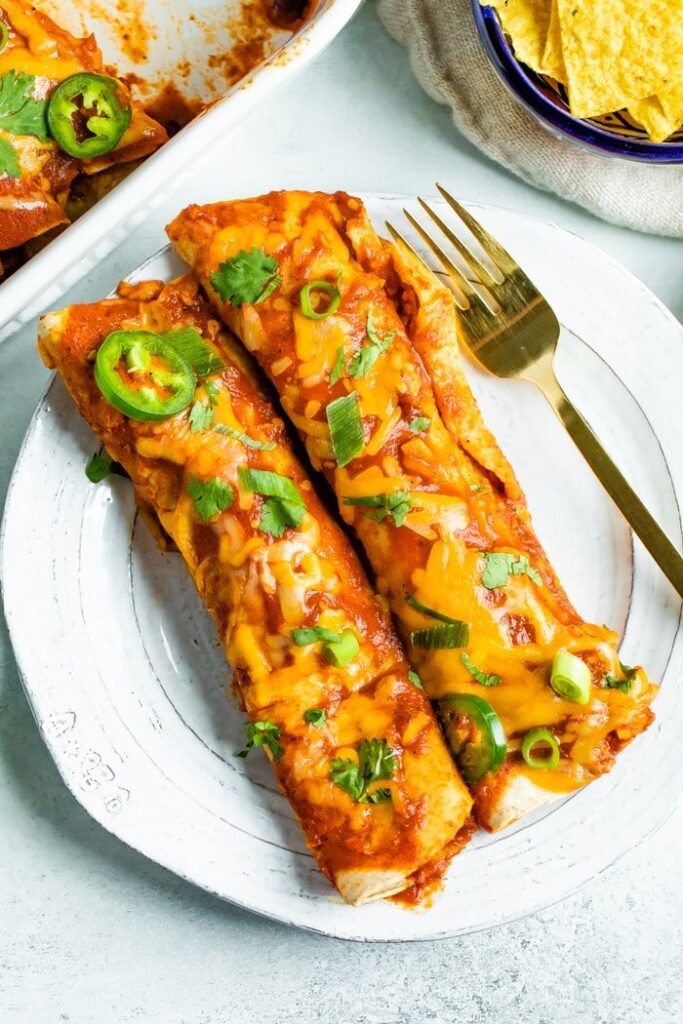 These healthy chicken enchiladas are packed with flavor and nutritious ingredients! The homemade enchilada sauce is the star of this recipe