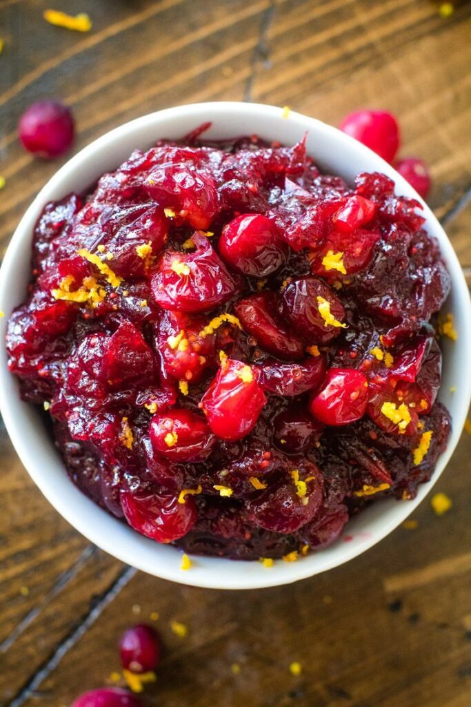 The delicious cranberry sauce recipe is flavored with orange and cinnamon to make it The Best Cranberry Sauce! It’s not the holidays without cranberry sauce and now you can make it homemade. It’s way better and super easy! Your guests will be thanking you for making this easy Thanksgiving side dish. 