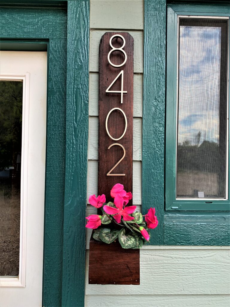 This simple DIY project is a quick way to add curb appeal to your home.  Made from an inexpensive cedar fence picket and house numbers, all you will also need is a saw, hammer and some nails to build! www.innovativehealthfitness.com