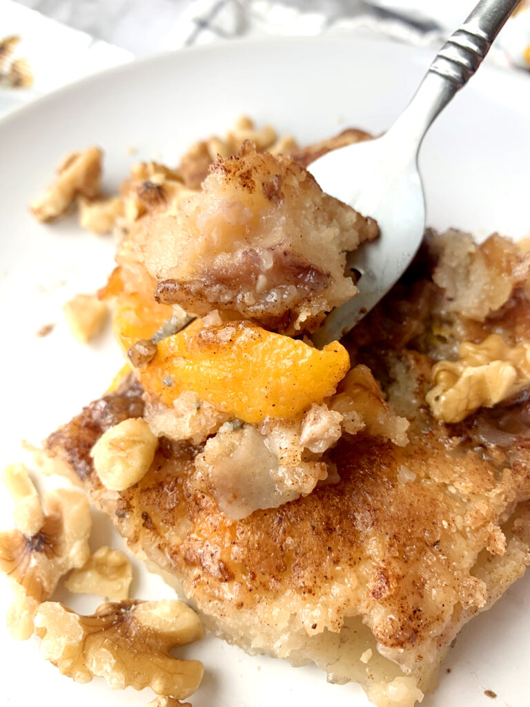 Walnut Peach Cobbler, a sweet and buttery dessert recipe that is loaded with fresh peaches and toasted walnuts. This is a simple and easy dessert to make all in one pan!! 