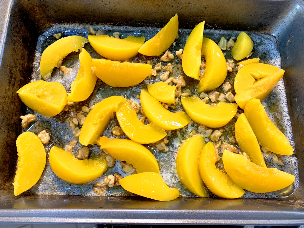 Walnut Peach Cobbler, a sweet and buttery dessert recipe that is loaded with fresh peaches and toasted walnuts. This is a simple and easy dessert to make all in one pan!! www.innovativehealthfitnesscom