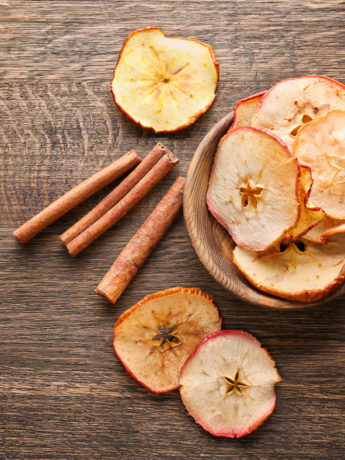 Apple Chips in a bowl on a wooden table