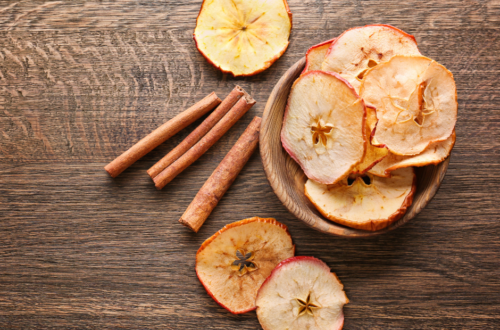 Apple Chips in a bowl on a wooden table