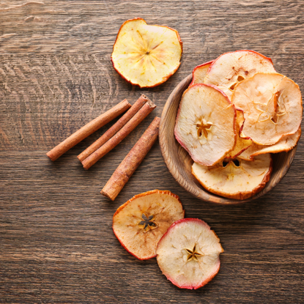 Apple Chips in a bowl on a wooden table