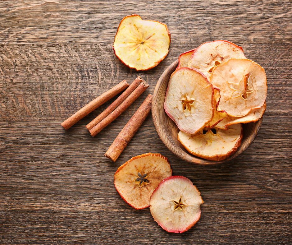 Apple Chips in a bowl on a wooden table