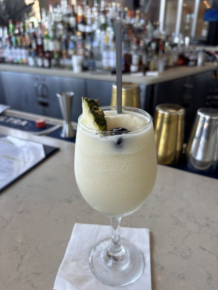 Classic Piña Colada served poolside at the oceanfront Caribe Hilton resort bar in San Juan, Puerto Rico.